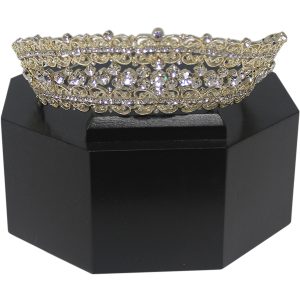 Tiara displayed on a black octagon pedestal