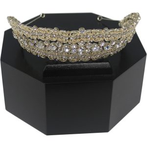 Tiara displayed on a black octagon pedestal